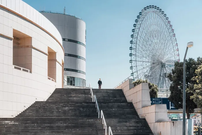 Framed Print : Man walks stairs in Yokohama, Japan, with Cosmo Clock 21 Ferris wheel in background Framed Print : Man walks stairs in Yokohama, Japan, with Cosmo Clock 21 Ferris wheel in background