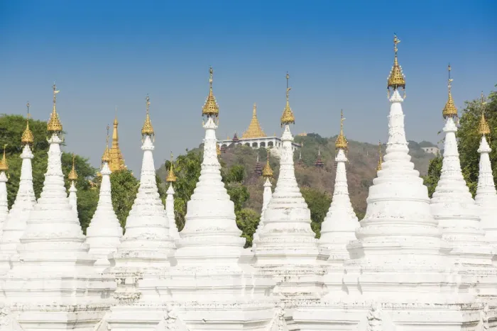 Framed Print : Mandalay, Myanmar. Kuthodaw pagodas spires with Mandalay hill on the background Framed Print : Mandalay, Myanmar. Kuthodaw pagodas spires with Mandalay hill on the background