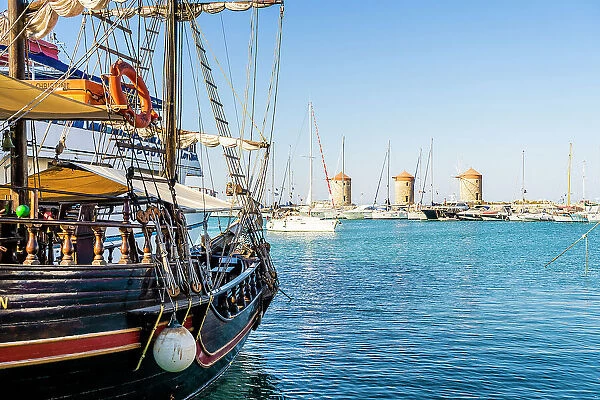 Mandraki Marina and Port looking towards Rhodes Windmills, Rhodes Town, Rhodes, Dodecanese Islands, Greece