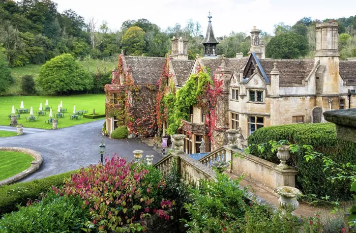 Framed Print : The Manor House, 14th century building set in 365 acres of secluded parkland in the Cotswold village Castle Combe, Wiltshire, Cotswolds, England Framed Print : The Manor House, 14th century building set in 365 acres of secluded parkland in the Cotswold village Castle Combe, Wiltshire, Cotswolds, England