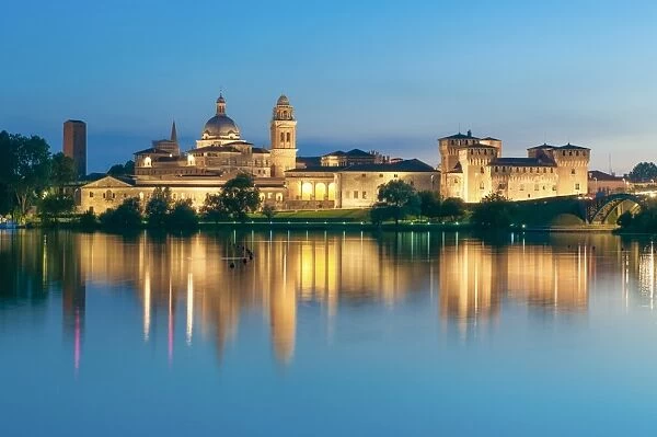 Mantova, Lombardy, Italy. Mincios banks with historical buildings at sunset
