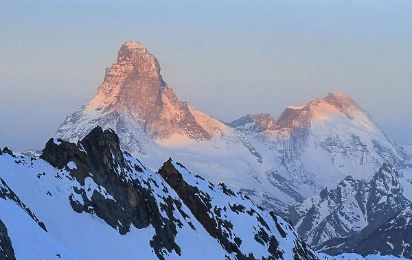 Matterhorn from the Dom de Mischabel glacier at sunrise. Switzerland, Europe
