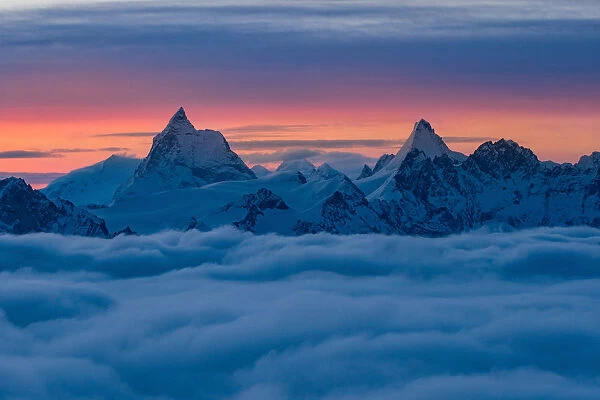 Matterhorn peak over a clouy carpet during a winter sunrise