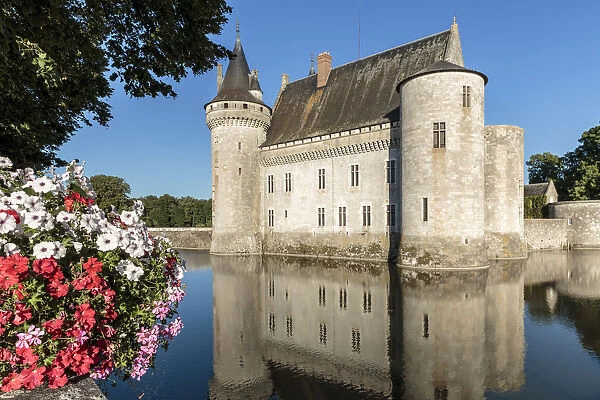 Medieval castle with flowers on the foreground. Sully-sur-Loire, Loiret, France