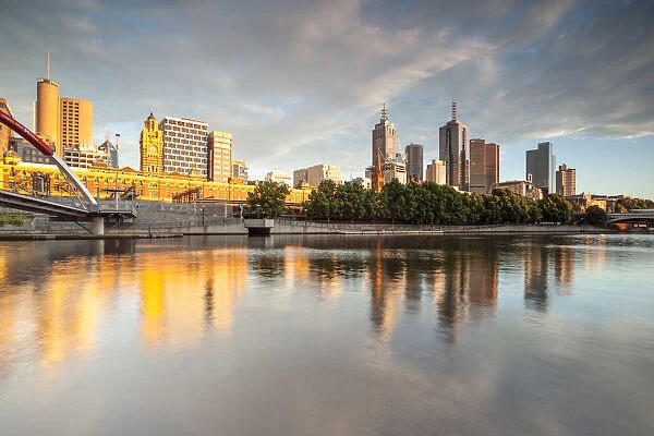 Melbourne, Victoria, Australia. Yarra river and city at sunrise, with Flinders station