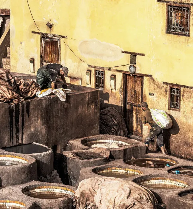 Framed Print : Men working with skins in traditional Moroccan leather tanneries, Fes, Morocco
