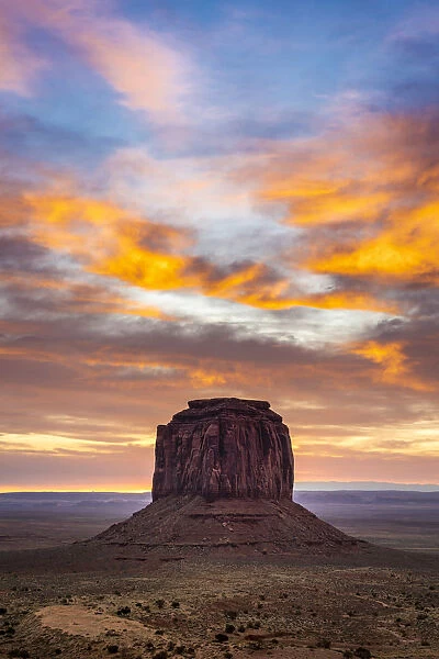 Merrick Butte against colourful cloudy sky at sunrise, Monument Valley, Arizona, USA