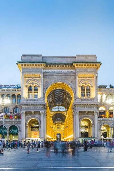 Milan, Lombardy, Italy. The entrance to the Galleria Vittorio Emanuele II illuminated