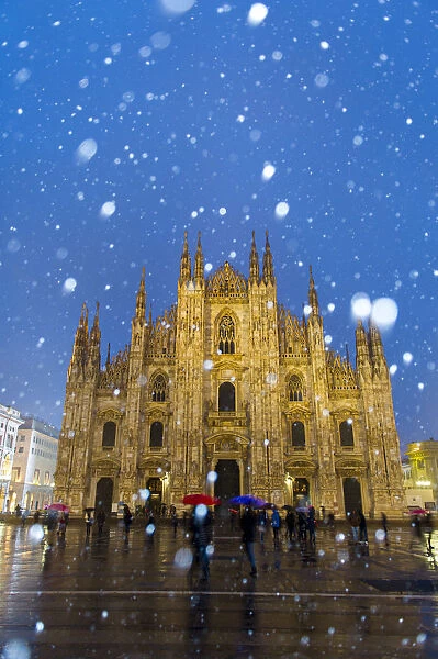 Milans Duomo cathedral in winter with snow and artificial lights