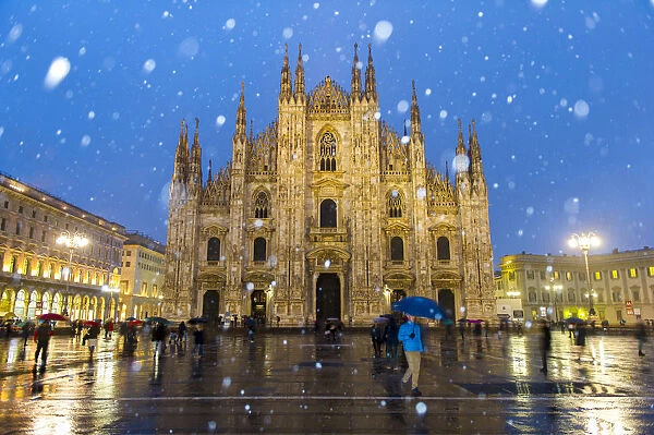 Milans Duomo cathedral in winter with snow and artificial lights. Milan, Lombardy
