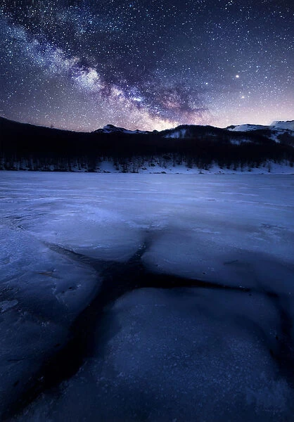 Milky way over a frozen lake (Lago Baccio) in the central Appennines, Emilia Romagna
