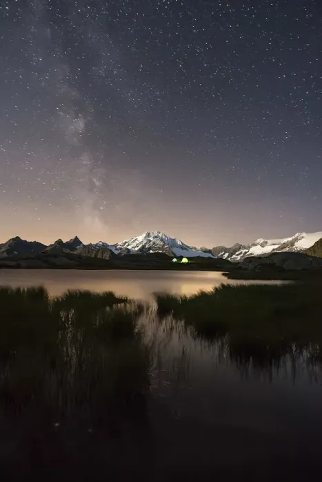 Framed Print : The Milky Way shines over the Fora Alp where some hikers have created their campsite Framed Print : The Milky Way shines over the Fora Alp where some hikers have created their campsite