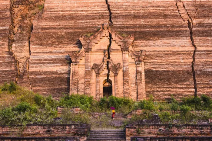 Framed Print : Mingun, Sagaing region, Myanmar (Burma). Woman with red umbrella climbs the stairs