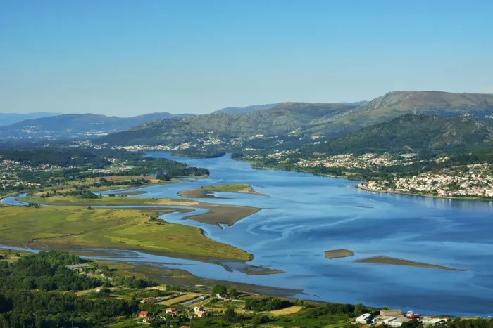Framed Print : Minho river between Portugal and Spain. Portugal on the background and spanish Galicia Framed Print : Minho river between Portugal and Spain. Portugal on the background and spanish Galicia