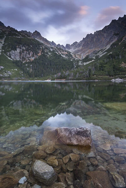 A mirror still Popradske Pleso lake in the High Tatras, Slovakia, Europe. Autumn