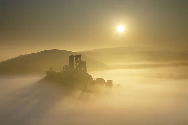 Mist below Corfe Castle at Sunrise, Dorset, England