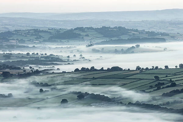 Mist over countryside at dawn near Brecon, Powys, Wales, UK