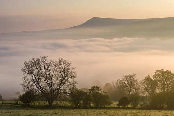 Mist covered Brecon Beacons landscape at dawn, Powys, Wales, UK