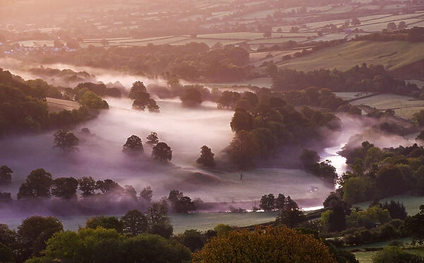 Mist lingers in the Usk Valley at dawn, Brecon Beacons National Park, Powys, Wales, UK
