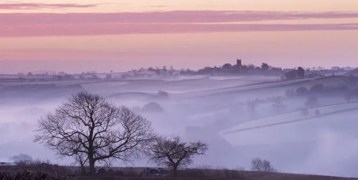Framed Print : Mist shrouded countryside looking towards the village of Morchard Bishop, Devon, England Framed Print : Mist shrouded countryside looking towards the village of Morchard Bishop, Devon, England