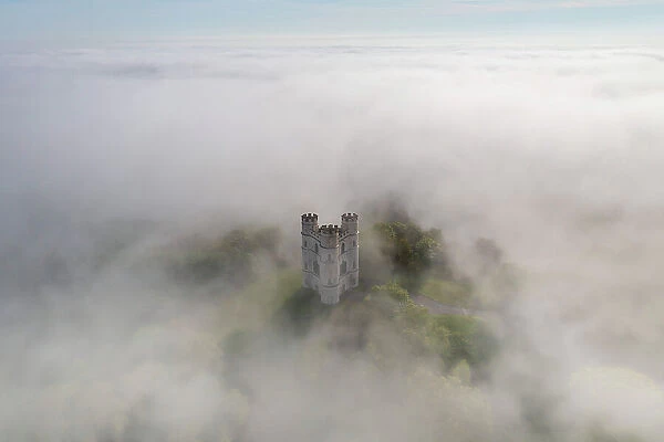 Mist surrounds Haldon Belvedere (Lawrence Castle) in Devon, England. Spring (May) 2023