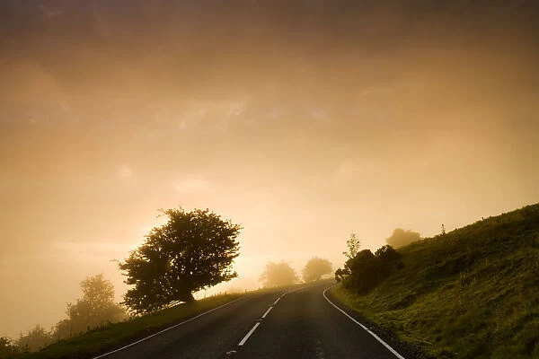 Misty conditions at sunrise on a moorland road, Brecon Beacons National Park, Powys