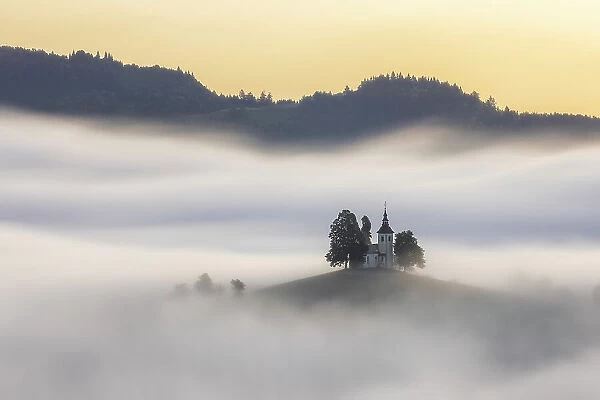 A misty dawn around St Thomas Church, Skofja Loka, Slovenia