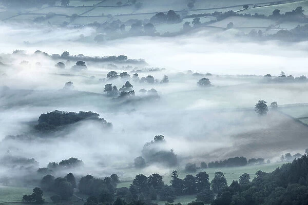 Misty dawn view over the Usk Valley from Tor y Foel, Brecon Beacons National Park, Powys