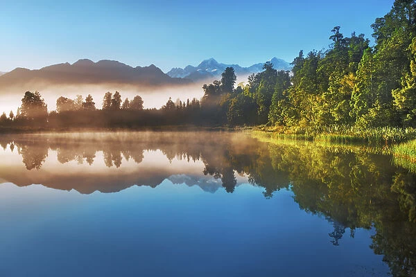 Misty mood at Lake Matheson - New Zealand, South Island, West Coast, Westland