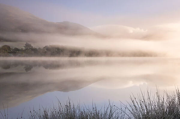 Misty morning over Loweswater in the Lake District, Cumbria, England. Autumn (November)