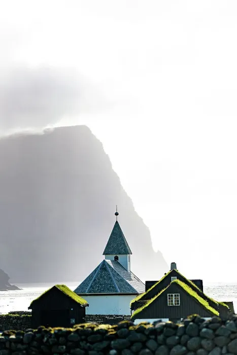 Framed Print : Misty sky over the traditional church of Vidareidi ovelooking a fjord, Vidoy Island, Faroe Islands Framed Print : Misty sky over the traditional church of Vidareidi ovelooking a fjord, Vidoy Island, Faroe Islands