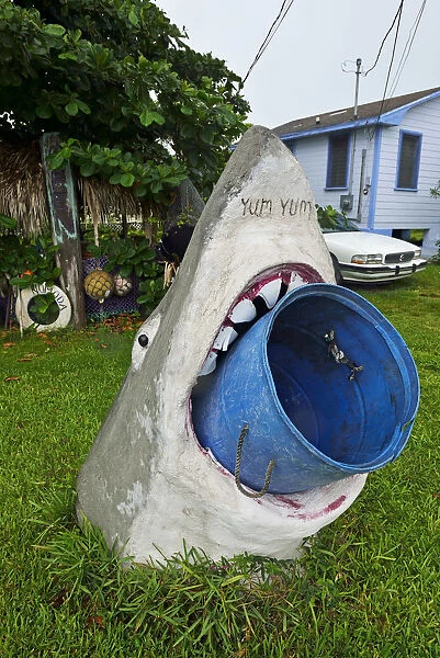 Model of a Great White Shark holds a rubbish bin in its mouth, Treasure Cay, Abacos