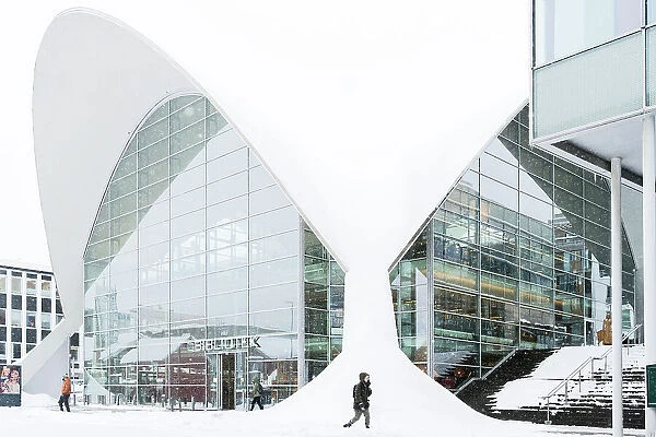 Modern building of the city library built with glass windows, Tromso, Norway
