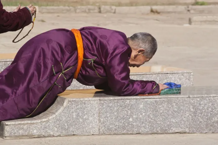 Framed Print : MONGOLIA, Ulaanbaatar, Monk prostrating at Gandan (Gandantegchenling) Monastery Framed Print : MONGOLIA, Ulaanbaatar, Monk prostrating at Gandan (Gandantegchenling) Monastery