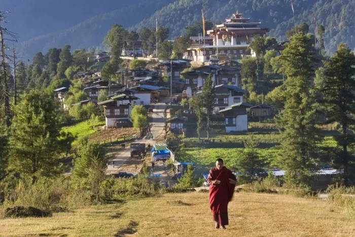 Framed Print : Monk leaving Gangtey Dzong (monastery), & village, Phobjikha Valley, Bhutan Framed Print : Monk leaving Gangtey Dzong (monastery), & village, Phobjikha Valley, Bhutan