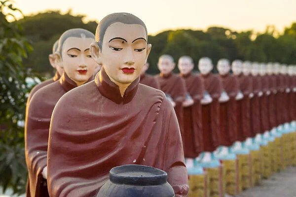 Monk statues at Myo Yar Pyae Pagoda at sunset, Monywa, Monywa Township, Monywa District