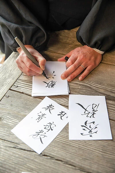 Monk writing calligraphy at Ekoin temple, Koya, Mount Koya, Kansai region, Honshu, Japan