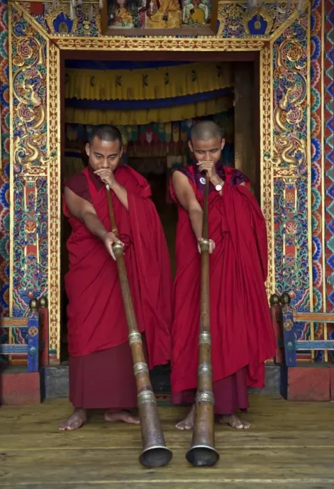 Framed Print : Two monks blow long horns called dung-chen, at the temple of Wangdue Phodrang Dzong Framed Print : Two monks blow long horns called dung-chen, at the temple of Wangdue Phodrang Dzong