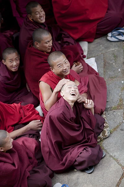 Monks debating at the Sangha of the Kharchu Monastery in Chamkar Bhutan