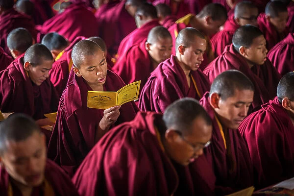 Monks at puja (prayers) at Kopan Monastery, Kathmandu, Nepal