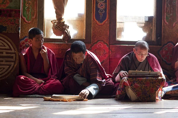 Monks at the sacred thread ceremony for the deceased in the monestery un Ura, Bumthang