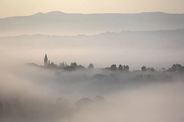 Montefalco in the mist, Umbria, Italy