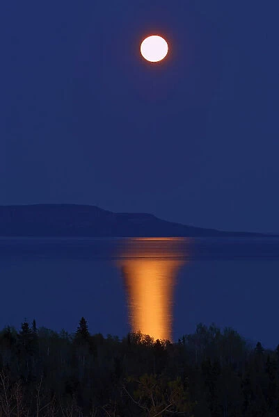 Full moon on Lake Superior at dusk. Thunder Bay, Ontario, Canada
