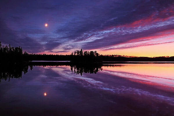 Full moon reflected in Longbow Lake Kenora, Ontario, Canada