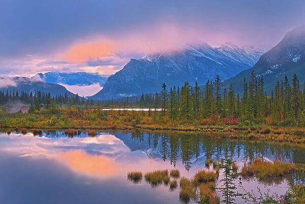 Morning light peaking through clouds, Banff National Park, Alberta, Canada