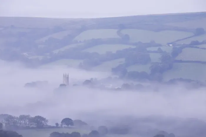 Framed Print : Morning mist swirls around the church tower of Widecombe in the Moor, Dartmoor, Devon Framed Print : Morning mist swirls around the church tower of Widecombe in the Moor, Dartmoor, Devon