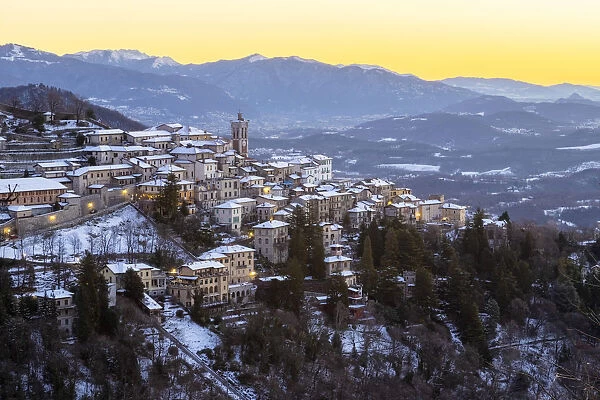 Morning view of the town of Santa Maria del Monte after a snowfall in winter from the