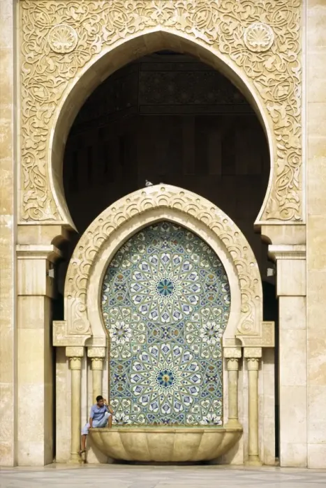 Framed Print : MOROCCO, Casablanca A visitor is dwarfed by the towering Framed Print : MOROCCO, Casablanca A visitor is dwarfed by the towering
