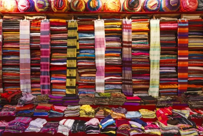 Framed Print : Morocco, Marrakech, Textiles and fabrics in a souk Framed Print : Morocco, Marrakech, Textiles and fabrics in a souk