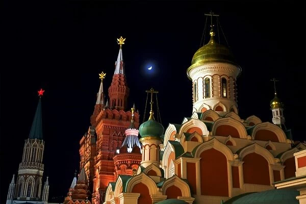 Moscow, Russia; Kazan Cathedral and towers from the History Museum in Red Square at night